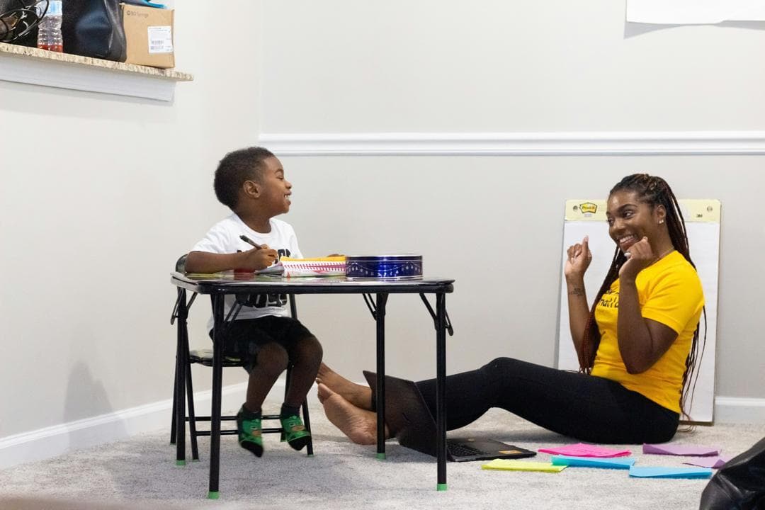Children playing with building blocks in a nurturing environment